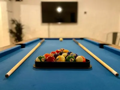 a pool table with a tray of balls on it at Entire Modern House Liverpool, 6 Bedrooms in Liverpool