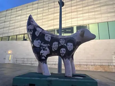 a statue of a cow with faces on it at 2 Bed Newly Furbished Whole House sleeps 4 in Liverpool