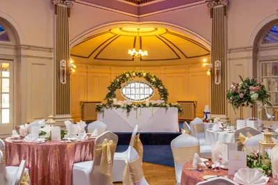 a banquet hall with tables and chairs in a room at Royal Clifton Hotel in Southport