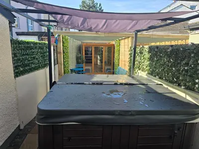 a patio with a mattress on top of a table at The Bay Cottage Hot Tub & Sauna Morecambe Bay in Morecambe