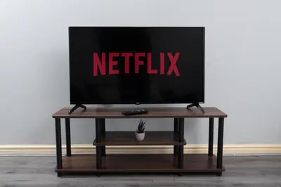 a flat screen tv sitting on top of a table at Central Liverpool Haven 3 bedroom House Private Parking in Liverpool