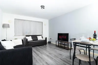 a living room with a couch and a table at Central Liverpool Haven 3 bedroom House Private Parking in Liverpool