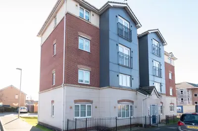 a tall building with a red brick at Central Liverpool Haven 3 bedroom House Private Parking in Liverpool
