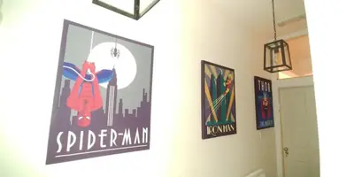 a hallway with posters on the walls of a room at Large Studio Room in City Centre (Shared Bathroom) in Preston