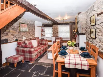 a living room with a table and a couch at 3 Bed in Grange-over-sands oc-83368 in Cartmel
