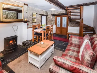 a living room with a couch and a fireplace at 3 Bed in Grange-over-sands oc-83368 in Cartmel