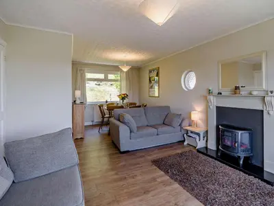 a living room with a couch and a fireplace at 3 Bed in Carnforth oc-sz425 in Arnside