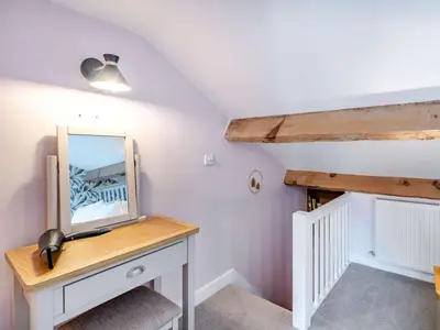 a room with a mirror on a dresser with at 3 Bed in Ulverston oc-87960 in Greenodd