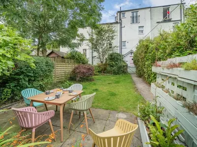 a patio with a table and chairs in a yard at 3 Bed in Ulverston oc-87960 in Greenodd