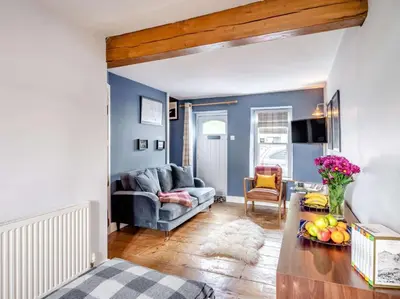 a living room with a couch and a table at 3 Bed in Ulverston oc-87960 in Greenodd