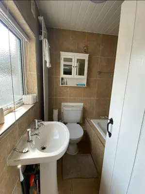 a bathroom with a white toilet and a sink at Outskirts of Ulverston, entire Cottage - sleeps 4 in Ulverston