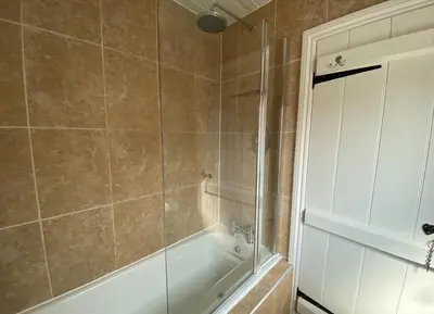 a bathroom with a shower and a bath tub at Outskirts of Ulverston, entire Cottage - sleeps 4 in Ulverston