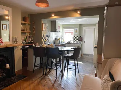 a kitchen with a table and chairs in a room at Outskirts of Ulverston, entire Cottage - sleeps 4 in Ulverston