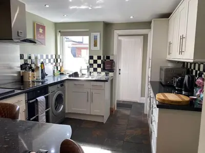 a kitchen with a sink and a dishwasher at Outskirts of Ulverston, entire Cottage - sleeps 4 in Ulverston