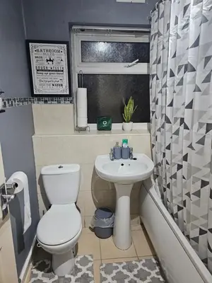 a bathroom with a toilet and a sink at Your Happy Place-2 Bedroom House in Liverpool