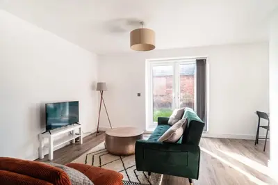 a living room with a couch and a coffee table at Modern 2 Bed Apartment in Waterloo Liverpool in Liverpool