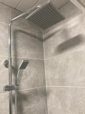 a shower with a shower head in a bathroom at Riverside by Teil Luxurious one bed Apartment in Preston