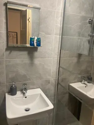 a bathroom with a sink and a mirror at Riverside by Teil Luxurious one bed Apartment in Preston