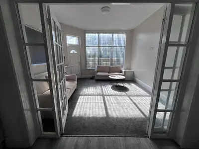 a living room with a couch and a window at Riverside by Teil in Preston