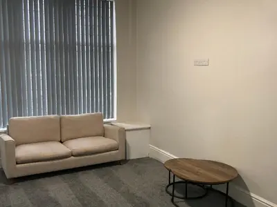 a living room with a couch and a table at Riverside by Teil in Preston