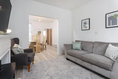 a living room with a couch and a chair at St Davids House - Air Host & Stay - 4 Bedrooms - Contractor Friendly in Liverpool