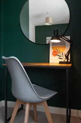 a desk with a white chair and a mirror at Modern 2-Bed Townhouse in Kirkdale in Liverpool