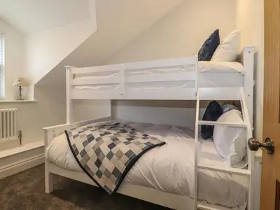a white bunk bed in a room at Old Watermill in Grange Over Sands