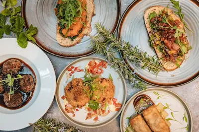 a group of plates of food on a table at Springbank Manor in Darwen