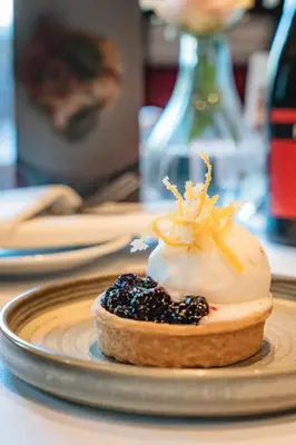 a dessert on a plate on a table at Springbank Manor in Darwen
