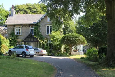 a house with two cars parked in front of it at st marys mount in Ulverston