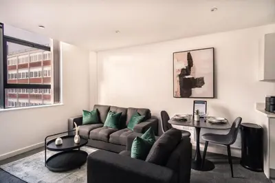 a living room with a couch and a table at Contemporary 1 Bed Apartment in Central Preston in Preston