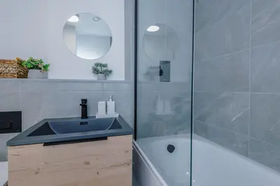 a bathroom with a sink and a shower at Stunning 2-Bed Premium Apartment - Free WI-FI in Preston