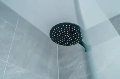 a shower with a black shower head in a bathroom at Stunning 2-Bed Premium Apartment - Free WI-FI in Preston