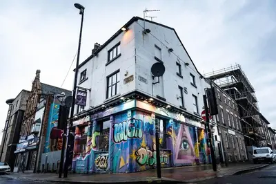 a building with graffiti on the side of it at Camden Apartments 1 in Liverpool