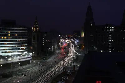a night view of a city street with traffic at Liver View Apartments in Liverpool