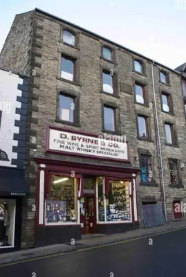 a brick building with a sign for a book store at CLITHEROE TOWN CENTRE MODERN 2 BED APARTMENT in Clitheroe