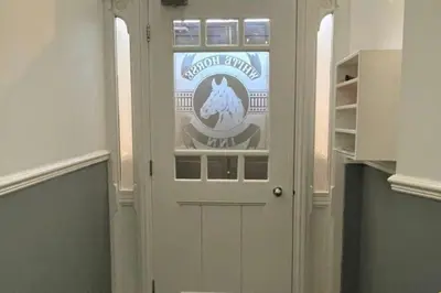 a door with a sign on it in a room at CLITHEROE TOWN CENTRE MODERN 2 BED APARTMENT in Clitheroe