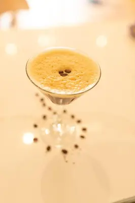 a wine glass filled with coffee on a table at Rufford Arms Hotel in Rufford