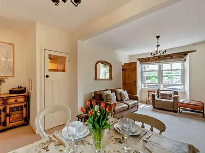 a living room with a table and a couch at 2 Bed in Grange-over-sands oc-73544 in Grange Over Sands
