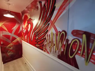 a room with a wall covered in graffiti at Unique LFC Themed House in Liverpool