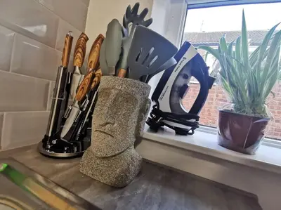 a counter with a bunch of knives on a window sill at Unique LFC Themed House in Liverpool