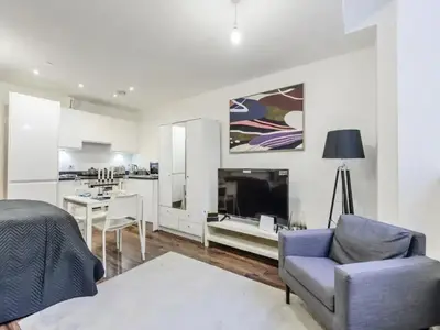 a living room with a couch and a chair at The Strand, Studio - Pass the Keys in Liverpool