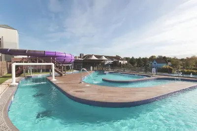 a large swimming pool with a water slide at Caravan Marton Mere Blackpool in Weeton