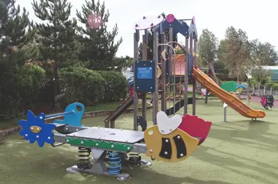 a playground with a slide in a park at Caravan Marton Mere Blackpool in Weeton