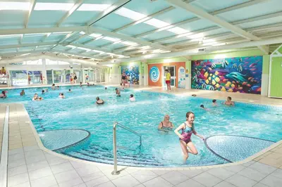 a group of people in a swimming pool at Caravan Marton Mere Blackpool in Weeton
