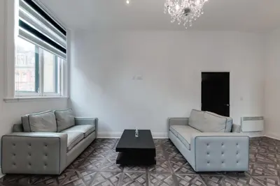 a living room with two couches and a coffee table at Temple Court Cavern Quarter Apartments by Happy Days in Liverpool