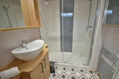 a bathroom with a sink and a shower at Pendle View Retreat - Holiday Park in Clitheroe