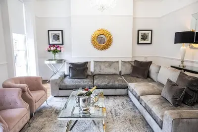 a living room with a couch and a table at Liverpool Georgian Quarter Townhouse Rodney St in Liverpool