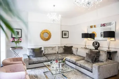 a living room with a couch and a table at Liverpool Georgian Quarter Townhouse Rodney St in Liverpool