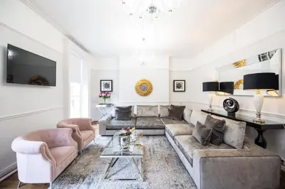 a living room with a couch and a table at Liverpool Georgian Quarter Townhouse Rodney St in Liverpool